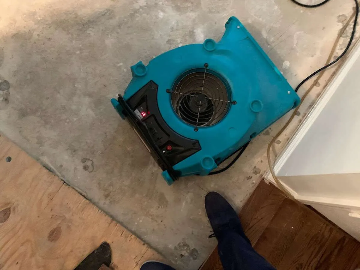 Air mover drying subfloor during Commercial Water Damage Restoration in Waipio Acres